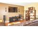 A modern living room with a comfortable brown leather sectional and stylish decor at 1416 Gleneagle Dr, Indianapolis, IN 46239