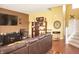 A modern living room with a comfortable brown leather sectional and stylish decor at 1416 Gleneagle Dr, Indianapolis, IN 46239