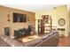 A modern living room with a comfortable brown leather sectional and stylish decor at 1416 Gleneagle Dr, Indianapolis, IN 46239