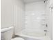 Bathroom featuring a toilet and shower-tub combination with built-in shelves at 14226 Marilyn Rd, Noblesville, IN 46060