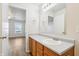 Bathroom featuring a vanity and mirror with an open doorway to another room at 14226 Marilyn Rd, Noblesville, IN 46060