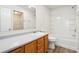 Bright bathroom features a vanity, sink, and shower-tub combination at 14226 Marilyn Rd, Noblesville, IN 46060