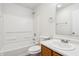 Clean bathroom featuring tub and shower, commode and vanity with sink and mirror at 14226 Marilyn Rd, Noblesville, IN 46060