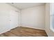 Light-filled bedroom featuring a closet and modern, wood-look flooring at 14226 Marilyn Rd, Noblesville, IN 46060