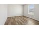 Bright bedroom with modern floors and a window that lets in plenty of natural light at 14226 Marilyn Rd, Noblesville, IN 46060