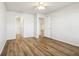 Bright bedroom showcasing wood-look floors and access to the bathroom and hallway at 14226 Marilyn Rd, Noblesville, IN 46060