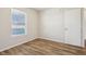 Bedroom with wood-look floors, natural light from window, and neutral wall paint at 14226 Marilyn Rd, Noblesville, IN 46060
