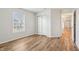 Bedroom with modern floors, bright window, and large closet with sliding doors at 14226 Marilyn Rd, Noblesville, IN 46060