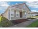 Charming single-story home with a covered front porch, set against a backdrop of well-maintained landscaping at 14226 Marilyn Rd, Noblesville, IN 46060