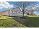 Quaint single-story home featuring a welcoming front porch and lush greenery surrounding the property at 14226 Marilyn Rd, Noblesville, IN 46060