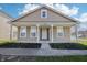 Charming single-story home featuring a cozy front porch with decorative columns and a well-maintained lawn at 14226 Marilyn Rd, Noblesville, IN 46060