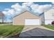 This garage has parking for two vehicles, wide driveway, and manicured green grass in a great neighborhood at 14226 Marilyn Rd, Noblesville, IN 46060