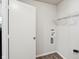 Well-lit laundry room featuring connections for washer and dryer and ample space for organizing and cleaning at 14226 Marilyn Rd, Noblesville, IN 46060