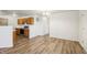 Open-concept living room features wood-look flooring and seamless flow to kitchen area at 14226 Marilyn Rd, Noblesville, IN 46060