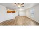 Bright living room featuring an open layout with wood-look flooring and a ceiling fan at 14226 Marilyn Rd, Noblesville, IN 46060
