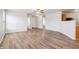 Bright and airy living room with wood-look floors and a ceiling fan, offering a comfortable living space at 14226 Marilyn Rd, Noblesville, IN 46060