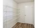 Pantry with wire shelving and modern floors offers ample storage at 14226 Marilyn Rd, Noblesville, IN 46060