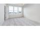 Bright bedroom with large windows, neutral carpet, and tray ceiling at 14538 Hanford Ln, Carmel, IN 46074