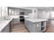 Kitchen with white countertops, stainless steel appliances, gray cabinets, and an island for entertaining at 14538 Hanford Ln, Carmel, IN 46074