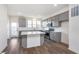 Bright kitchen featuring an island, stainless steel appliances, gray cabinets, and white countertops at 14538 Hanford Ln, Carmel, IN 46074
