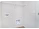 Bright laundry area with washer and dryer hookups and white wire shelving for easy storage at 14538 Hanford Ln, Carmel, IN 46074