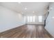 Bright living room with modern floors, an open concept layout, and large windows providing natural light at 14538 Hanford Ln, Carmel, IN 46074
