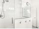 The bathroom is equipped with a glass-enclosed shower and stylish accents, including a decorative clock and hooks at 1501 Chanson Ln, Westfield, IN 46074