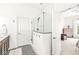 This bathroom showcases a modern glass shower, patterned floor, and is conveniently located next to the bedroom at 1501 Chanson Ln, Westfield, IN 46074