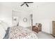 Bright primary bedroom with ceiling fan, large windows and ensuite bathroom at 1501 Chanson Ln, Westfield, IN 46074