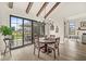 Dining area featuring a wood table, large windows and view of the backyard patio at 1501 Chanson Ln, Westfield, IN 46074