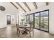 Dining area boasts a wood table, large windows and view of the backyard patio at 1501 Chanson Ln, Westfield, IN 46074