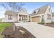 Charming single-Gathering home boasts a brick exterior, manicured lawn, and an attached garage at 1501 Chanson Ln, Westfield, IN 46074