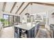 Open kitchen features an island with marble countertops, wine rack and sliding glass doors to outdoor patio at 1501 Chanson Ln, Westfield, IN 46074
