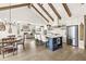 Open concept living area with vaulted ceilings, beams, kitchen island and dining area at 1501 Chanson Ln, Westfield, IN 46074