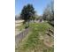 Backyard features grassy areas, a storage shed, and a deer statue at 1623 S Grant Ave, Indianapolis, IN 46203