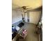 Bedroom with ceiling fan, bi-fold closet doors, and tile flooring at 1623 S Grant Ave, Indianapolis, IN 46203