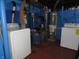 Basement laundry area, featuring modern washer and dryer units at 1722 N Parker Ave, Indianapolis, IN 46218