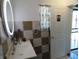 Well-lit bathroom with vanity, sink, and modern lighted mirror, offering functionality and style at 1722 N Parker Ave, Indianapolis, IN 46218