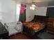 Cozy bedroom featuring dark wood floors and good natural light at 1722 N Parker Ave, Indianapolis, IN 46218