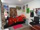 This bedroom has wood laminate floors with lots of posters on the walls at 1722 N Parker Ave, Indianapolis, IN 46218