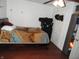 Simple bedroom featuring hardwood floors, a queen sized bed, and an overhead ceiling fan at 1722 N Parker Ave, Indianapolis, IN 46218