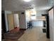 Bright kitchen featuring white cabinets, an eat-in area, and modern appliances at 1722 N Parker Ave, Indianapolis, IN 46218