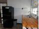 Efficient kitchen featuring butcher block countertops, modern appliances, and ample storage at 1722 N Parker Ave, Indianapolis, IN 46218