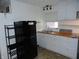 Well-lit kitchen with white cabinets, butcher block countertops, and modern appliances at 1722 N Parker Ave, Indianapolis, IN 46218