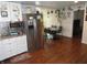 Spacious eat-in kitchen with stainless steel appliances, hardwood floors, and white cabinetry at 1722 N Parker Ave, Indianapolis, IN 46218