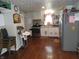 Spacious kitchen with stainless steel appliances, white cabinetry, and hard wood floors at 1722 N Parker Ave, Indianapolis, IN 46218