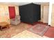 Living room featuring wood paneled walls, an area rug, and a recliner at 1722 N Parker Ave, Indianapolis, IN 46218
