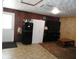 Cozy living room area with a refrigerator and tv at 1722 N Parker Ave, Indianapolis, IN 46218