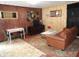 Inviting living room with a comfortable sofa, dining area, and warm wood accents at 1722 N Parker Ave, Indianapolis, IN 46218
