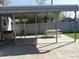 Covered parking structure with a picnic table at 1722 N Parker Ave, Indianapolis, IN 46218